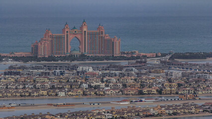 Jumeirah Palm Island night to day timelapse dubai shot from the rooftop top of the tower in dubai marina, uae