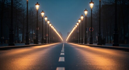 Road with vintage street lamps leading to infinity at dusk
