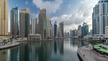 Obraz premium Dubai Marina towers and canal in Dubai night to day timelapse