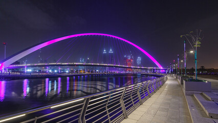 Pedestrian Bridge over the Dubai Water Canal night timelapse hyperlapse, United Arab Emirates