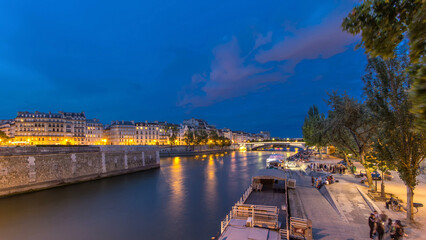 View to the Pont De La Tournelle on the River Seine day to night timelapse with waterfront.