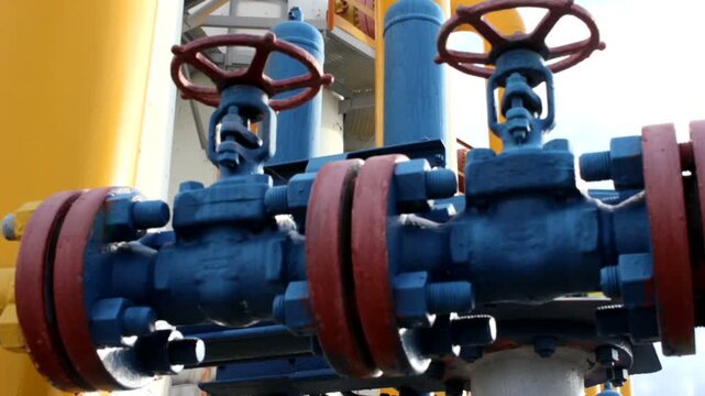 Smooth slider footage of a clean, operational oil and gas plant with pipelines, storage tanks, and refining equipment—no smoke, clear daylight, ideal for energy, industrial, or corporate content.