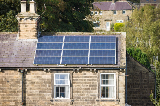 Solar panels on roof of house, Yorkshire, UK