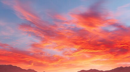 Vibrant Sunset Sky with Colorful Clouds Over Mountains in a Scenic Nature Landscape at Dusk