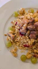Migas with pork, grapes, and red pepper