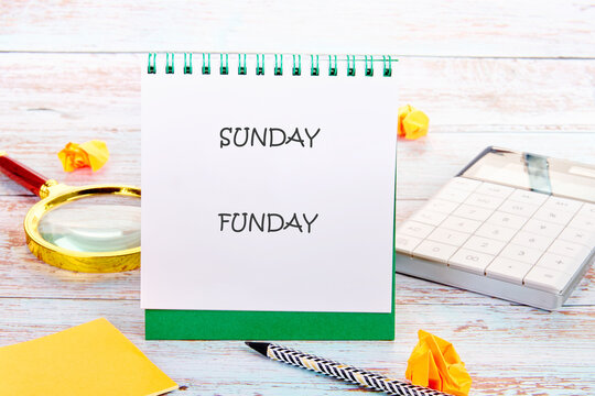 A cheerful setup featuring a notebook with SUNDAY FUNDAY written on it, surrounded by a magnifying glass, calculator, and crumpled paper, perfect for planning fun activities - Powered by Adobe