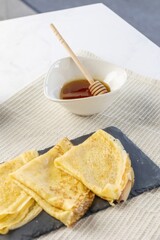 Sweet crepes with honey for a delicious breakfast