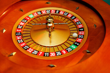 Close-up of roulette wheel with ball and numbers