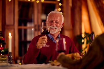 Warm Family Dinner With Wine and Candles for New Year Celebration