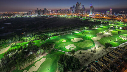 Dubai Marina skyscrapers and golf course day to night timelapse, Dubai, United Arab Emirates