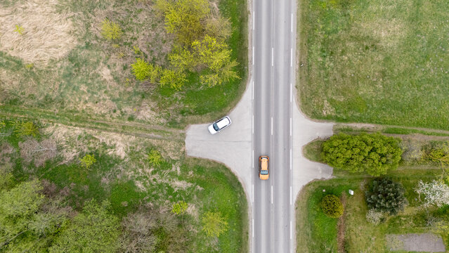 Aerial View of Rural Intersection with Cars