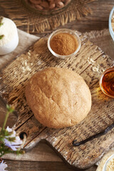 A ball of dough made of whey protein powder, ground oat flakes, cinnamon, maple syrup and nut butter - preparation of homemade snack bars
