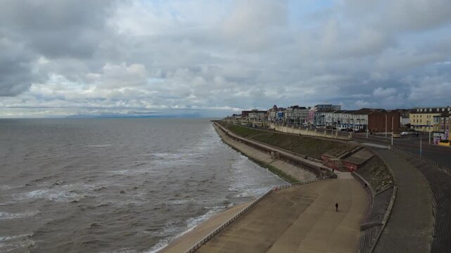 aerial drone view of the promenade in north blackpool with hotels along the seafront and promenade
