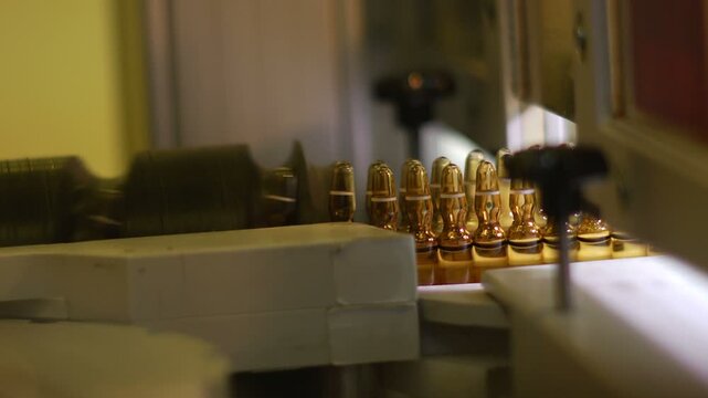 High-definition footage of an automated cleanroom assembly where glass ampoules are washed, filled with injectable medication, sterilized, and hermetically sealed. Showcases precision robotics, strict