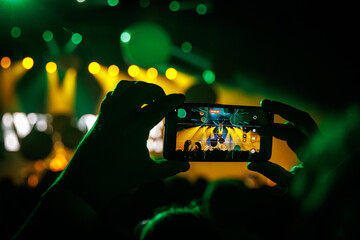Recording a live concert with smartphone during colorful stage lighting