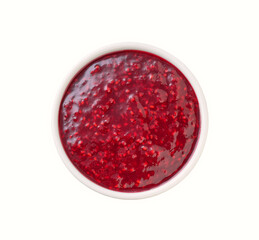 raspberry jam in a white ceramic  bowl isolated on white background, top view.