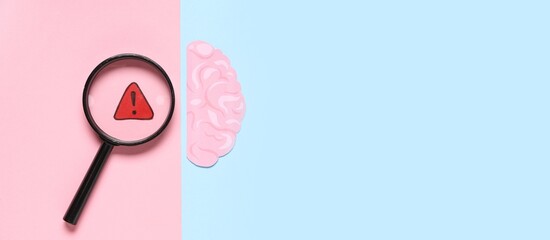 Paper human brain, warning sign and magnifying glass on color background with space for text, top view