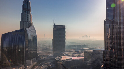Dubai downtown street with busy traffic and skyscrapers around timelapse.