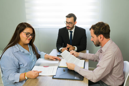 Couple meeting lawyer for divorce agreement signing