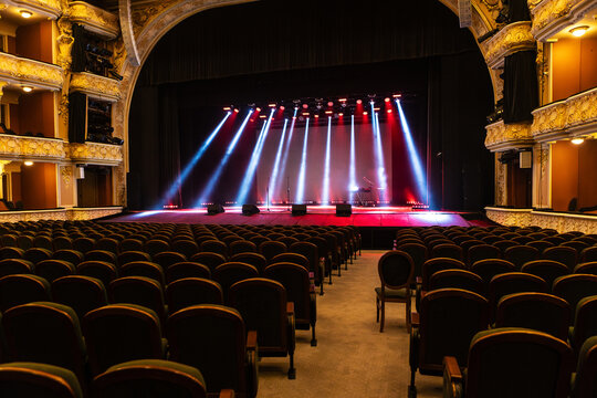 A spotlight on an empty stage.