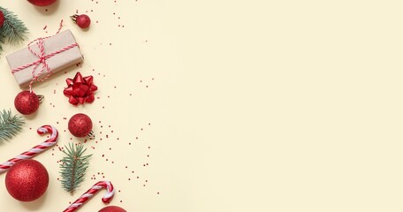 Christmas decorations on beige background with space for text