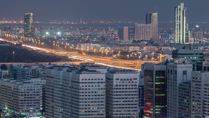 Obraz premium Aerial skyline of Abu Dhabi city centre from above day to night timelapse