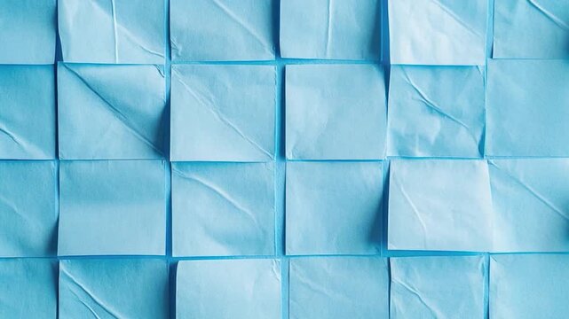 A collection of bright blue Post-it Notes stacked on top of each other