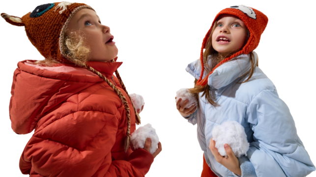 Two children holding snowballs looking up with excitement and curiosity on transparent background. Concept of winter play, joyful discovery, and expressive kids fashion showing warmth and character.