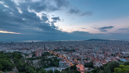 Panorama of Barcelona night to day timelapse, Spain, viewed from the Bunkers of Carmel