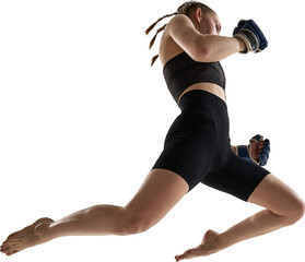 Female fighter jumping in air throwing forward punch wearing blue gloves. Concept of agility, empowerment, energy, sports motivation, and strength in motion. Transparent background