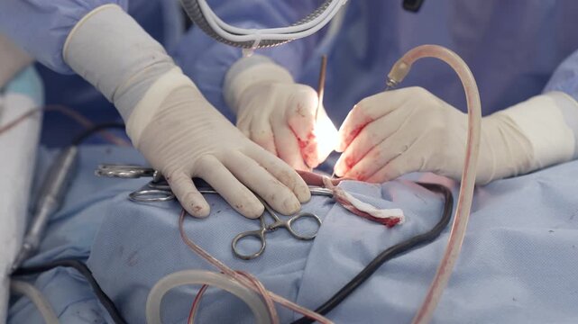 A surgeon performs tympanoplasty surgery on a patient to help him hear