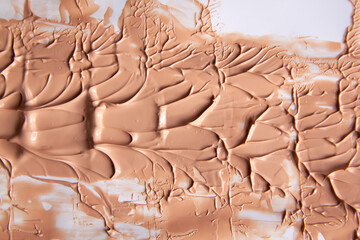 Obraz premium Fluid makeup product stain captured in soft light. A minimalist expression of skincare elegance.