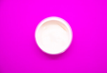 White cosmetic cream in a small jar. Beauty product.