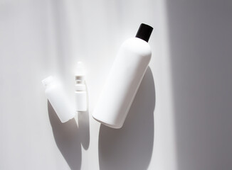 Group of a white cosmetic bottles. Plastic packaging for cosmetics and medical products.