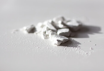 Closeup of loose powder with fine particles. Softness and tactile appeal in focus.