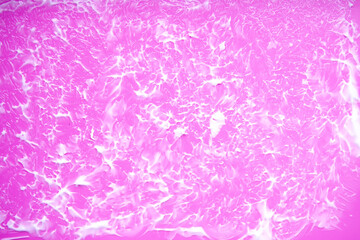 Smooth liquid cream creating abstract patterns on bright surface. Aesthetic simplicity with feminine appeal.