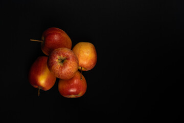 Red apples on a black background. Red apples.