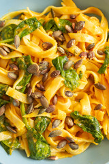 pumpkin pasta with spinach fall cozy dinner close up