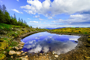 View of the idyllic landscape on the Goldeck. A mountain in the Latschur Group in the Gailtal Alps in Carinthia near Spittal an der Drau. Nature at the mountain lake.
