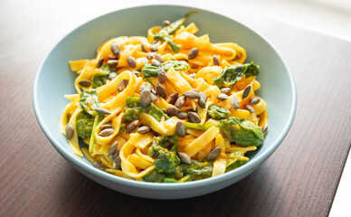 pumpkin pasta with spinach fall cozy dinner close up