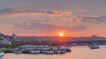 Obraz premium Passenger Ferry in the Bosphorus at sunset timelapse, Istanbul skyline, Turkey