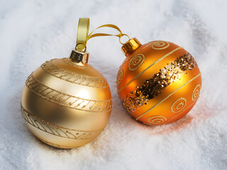 Elegant golden Christmas ornaments sparkling with festive cheer, perfect for holiday promotions and seasonal marketing campaigns with a touch of luxury