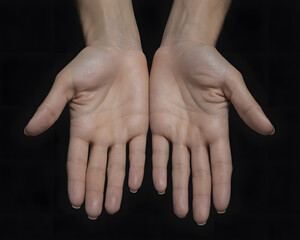 Offering open palms on black background for healing, guidance, or support concepts, conveying trust, sincerity, and vulnerability in digital spaces