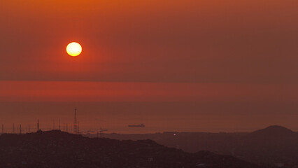 Obraz premium Aerial view of the Pacific ocean during sunset timelapse from Cerro San Cristobal, Lima