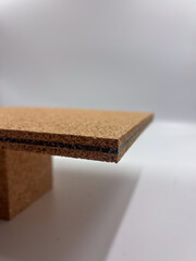 Macro shot showing the edge of a cork and rubber layered composite with fine natural texture.