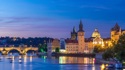 View of the city Prague in Czech Republic day to night timelapse on the Vltava river with beautiful sky