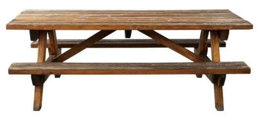 Isolated image of a classic wooden picnic table with attached benches and a weathered appearance