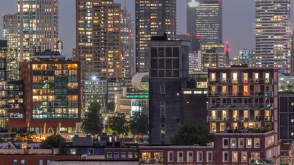 Aerial day to night timelapse of Katendrecht peninsula and Maashaven harbour in Rotterdam, The Netherlands.