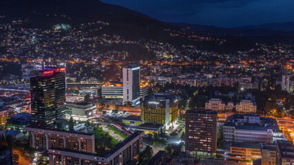 Fototapeta premium Aerial view of the southern part of Sarajevo city day to night timelapse.