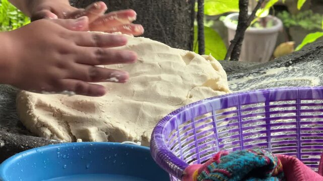 Hands Kneading Masa for Making Fresh Corn Tortillas